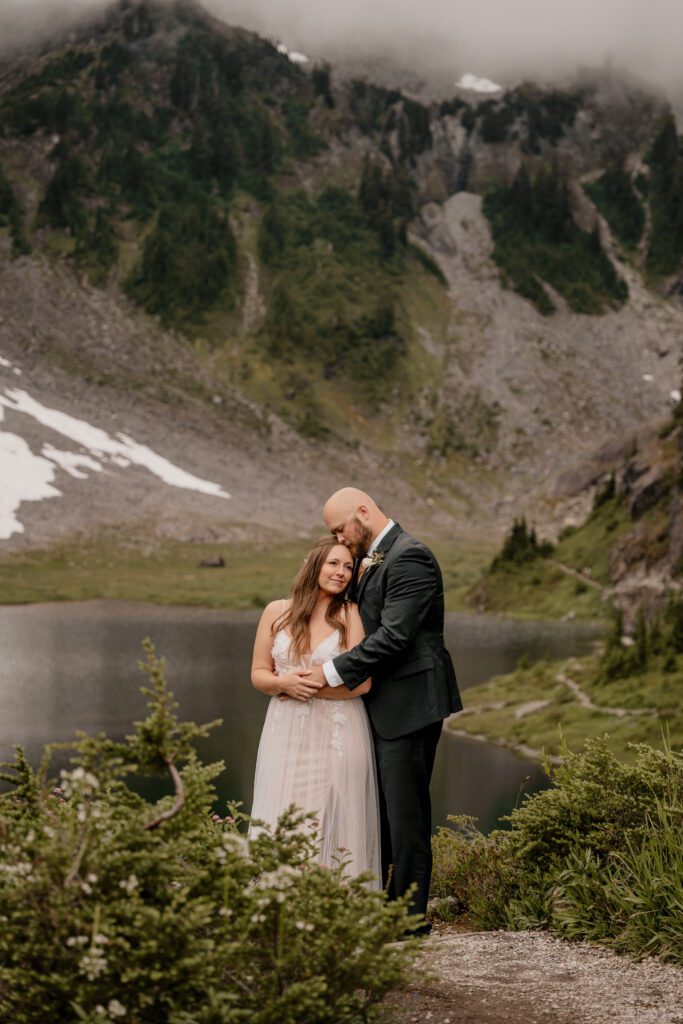 Couple taking elopement portraits at Bagley Lakes