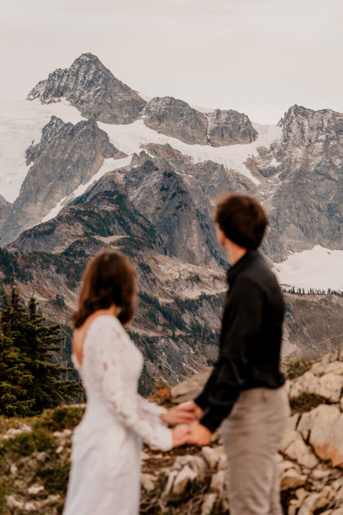 Couple admiring Mt. Shuksan during their October elopement at Artist Point.
