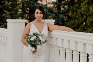 Washington wedding photographer capturing a portrait of the bride on the balcony at Beecher Hill House in Leavenworth, Washington