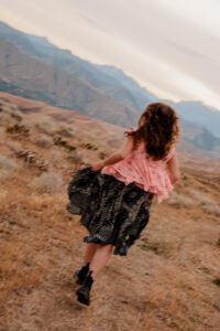 Ethereal senior portraits of a girl running in the mountains of Wenatchee, Washington