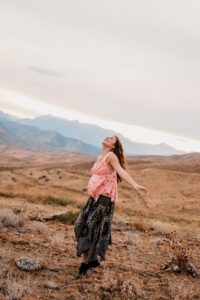 Senior portrait of a girl twirling in the mountains of Wenatchee, Washington