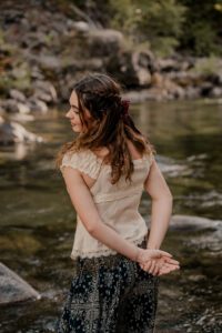 Ethereal senior portraits of a girl on the river in Leavenworth, Washington