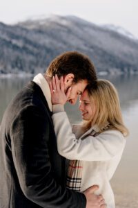 A newly engaged couple puts their photos together after after getting engaged at Lake Wenatchee in Leavenworth, WA
