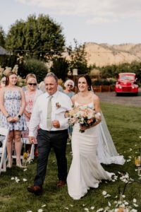 Bride walking down the aisle at The Barn on Hinman