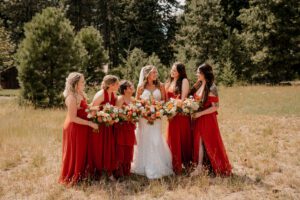 Bride and bridesmaids in the field at Brown Family Homestead