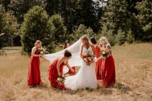 Bride and bridesmaids in the field at Brown Family Homestead